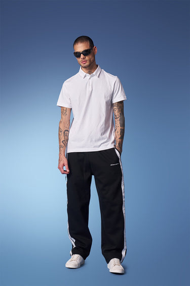 Black sporty straight fit pants from Bonkers Corner, featuring a comfortable, casual design with a relaxed fit.