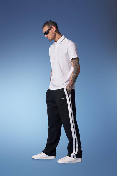 Black sporty straight fit pants by Bonkers Corner, shown in a relaxed fit style with a comfortable waistband.