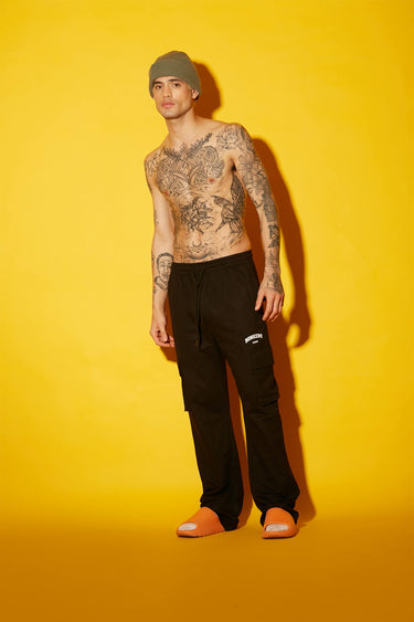 Black utility straight fit pant by Bonkers Corner, showing tailored design and multiple utility pockets.