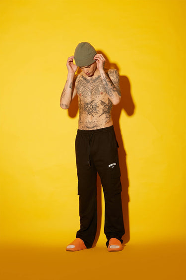 Black Bonkers Corner utility straight fit pants, shown on a mannequin, with multiple functional pockets and sleek design.