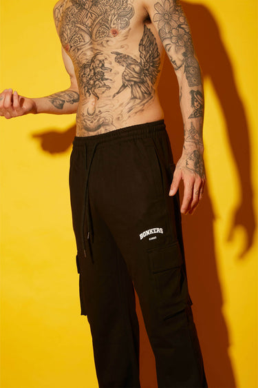 Black utility straight fit pants by Bonkers Corner, featuring a sleek design and functional pockets for casual or workwear style.