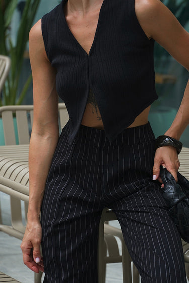 Black vest top by Bonkers Corner, fitted sleeveless shirt with a round neckline and casual style.