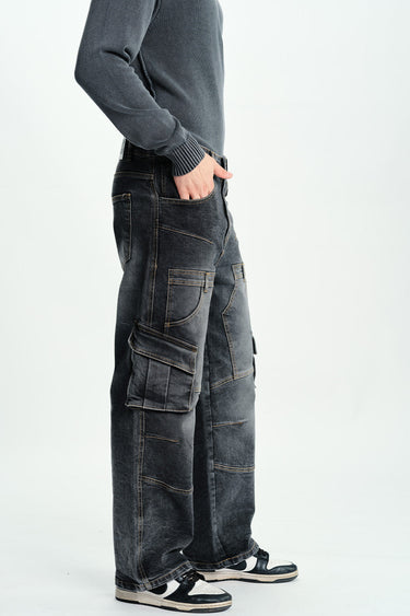 Black wash workwear cargo jeans by Bonkers Corner with multiple pockets and a relaxed fit, shown on a model.