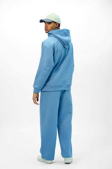 Blue Bonkers Corner everyday joggers, lightweight and comfortable, shown on a hanger with elastic waist and cuffed ankles.
