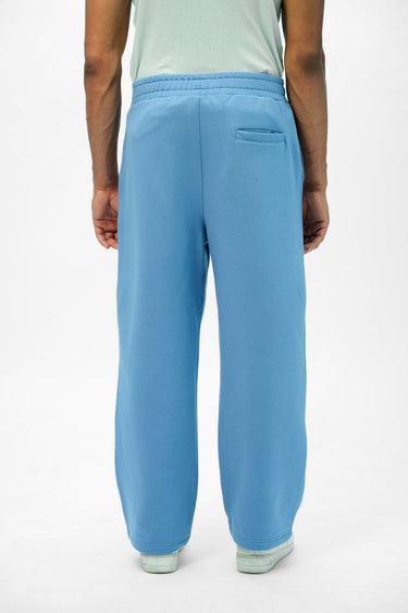 Blue Bonkers Corner Everyday Joggers, slim-fit casual pants with elastic waist and cuffs, shown on a model.
