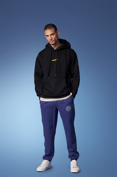 Blue heavyweight joggers from Bonkers Corner with a relaxed fit, featuring an elastic waistband and cuffed ankles.