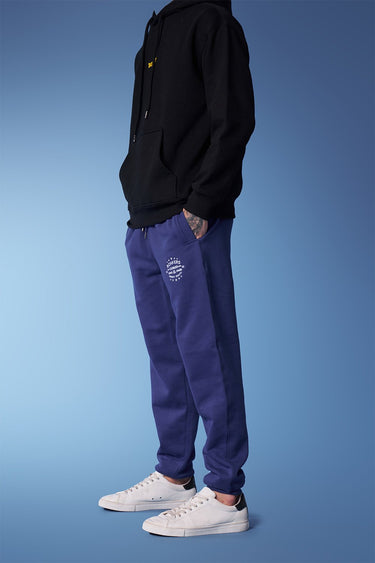 Blue heavyweight joggers from Bonkers Corner, showing the relaxed fit and soft fabric detail.