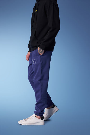 Blue heavyweight joggers by Bonkers Corner, featuring a relaxed fit and soft fabric for comfortable casual wear.