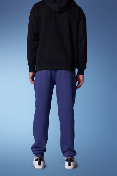 Blue heavyweight joggers by Bonkers Corner, shown in a close-up view highlighting the fabric and fit.