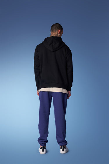 Blue heavyweight joggers from Bonkers Corner, showing relaxed fit and elastic waistband on a neutral background.