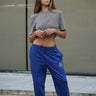 Blue heavyweight joggers from Bonkers Corner with a relaxed fit and elastic waistband, shown on a model.