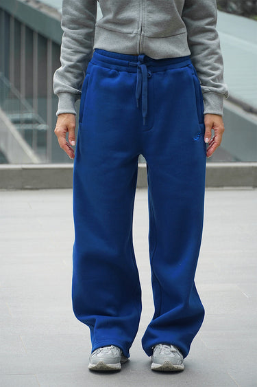 Light blue Bonkers Corner On The Go Joggers displayed on a model, showcasing comfortable athletic fit and casual style.