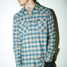 Blue Prussian regular fit shirt by Bonkers Corner, shown on a hanger with a classic collar and long sleeves.