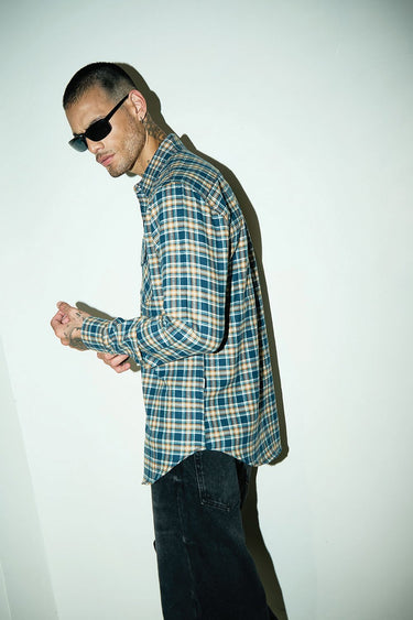 Blue Prussian regular fit shirt by Bonkers Corner, shown folded with button-down collar and long sleeves, casual men's clothing.
