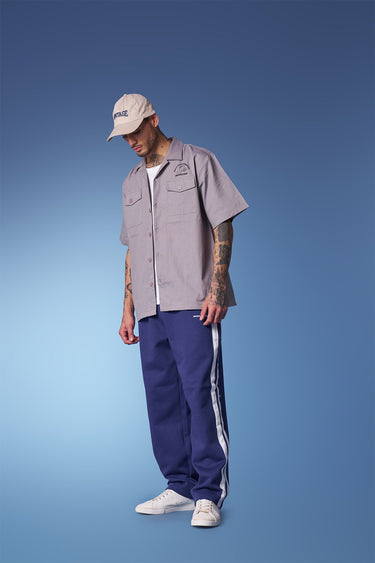 Blue sporty straight fit pants by Bonkers Corner, shown in a casual style with a comfortable waistband and sleek design.