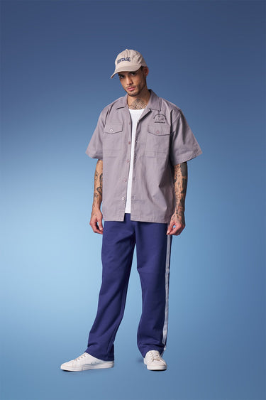 Blue sporty straight fit pants by Bonkers Corner, shown in a close-up image highlighting the comfortable fabric and fit.