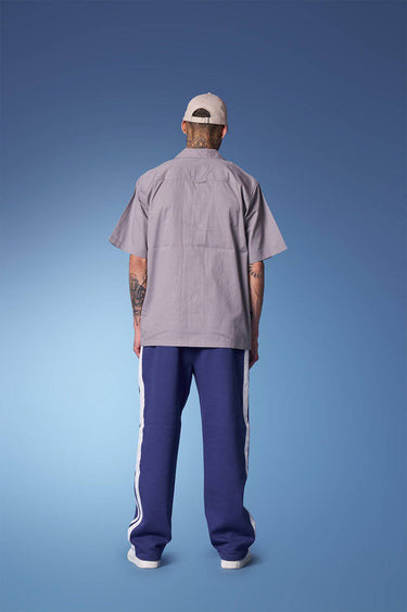 Blue sporty straight fit pants from Bonkers Corner, casual athletic style, with an elastic waistband and relaxed fit.