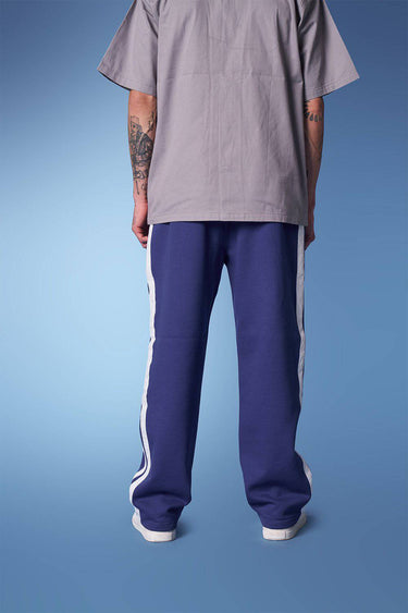 Blue sporty straight fit pants by Bonkers Corner, featuring a comfortable, casual design with a relaxed fit.