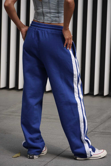 Blue sporty straight fit pants by Bonkers Corner, displayed flat with waistband and leg details visible.