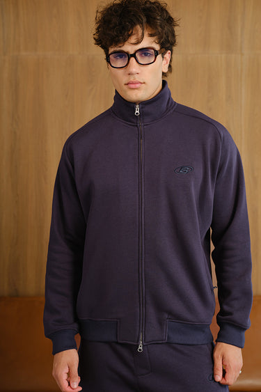 Blue Void high neck zipper jacket by Bonkers Corner, featuring a sleek design and front zipper, shown on a model.