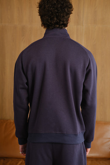 Blue Void high neck zipper jacket from Bonkers Corner, featuring a sleek design and front zipper detail.