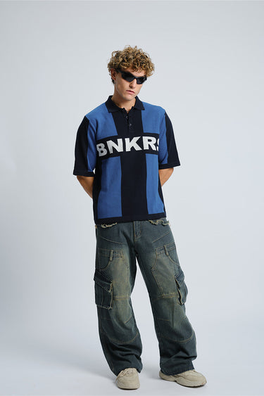 Bonkers Corner BNKRS Legacy Knit Polo in XS, featuring a classic collar and knit fabric, shown on a model.