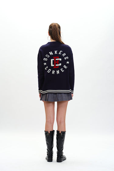 Bonkers Corner varsity crewneck sweatshirt in light blue with contrasting striped cuffs and collar, casual athletic style.