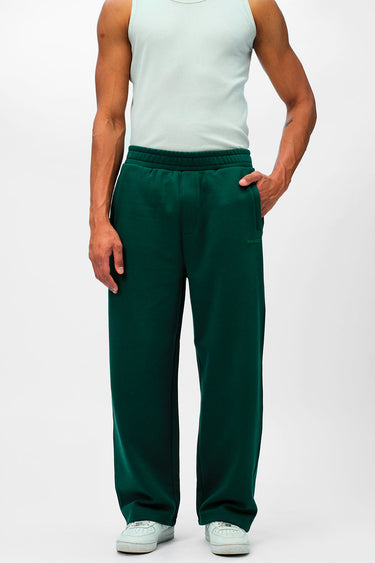 Bonkers Corner bottle green everyday joggers on a model, showing relaxed fit and soft fabric for casual wear.