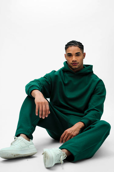Bottle green everyday joggers by Bonkers Corner, featuring a comfortable fit and casual style, shown in a close-up front view.
