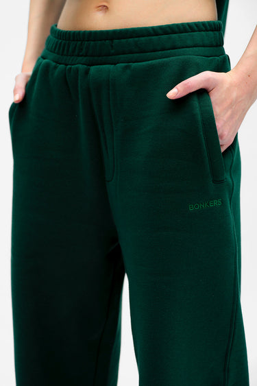 Bonkers Corner bottle green everyday joggers shown on model, featuring relaxed fit and comfortable elastic waistband.