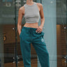 Bonkers Corner bottle green heavyweight joggers made of soft, durable fabric with a comfortable fit and elastic waistband.