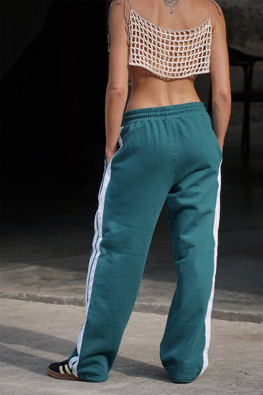 Bonkers Corner bottle green sporty straight fit pants displayed on a model, featuring a comfortable athletic design.
