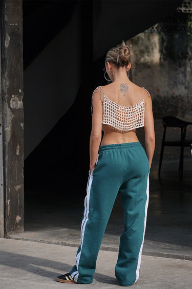 Bonkers Corner bottle green sporty straight fit pants displayed on a model, featuring a casual athletic style and comfortable fit.