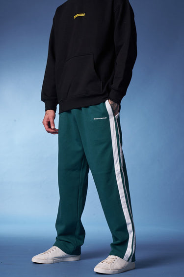 Bottle green sporty straight fit pants by Bonkers Corner, shown in a casual style with an elastic waistband and relaxed fit.
