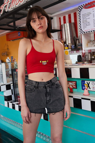Bonkers Corner Bratty Pickles red camisole top shown on a model, featuring thin straps and a fitted design.