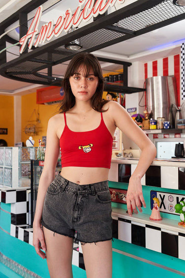 Red Bratty Pickles cami top by Bonkers Corner, shown on a model, with adjustable straps and a fitted style.