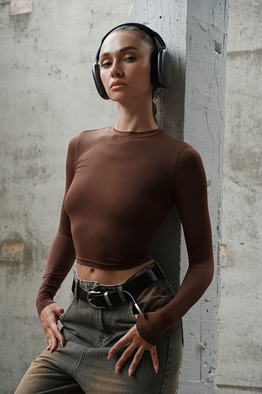 Brown full-sleeves polyamide top by Bonkers Corner, shown on a model, with a fitted style and smooth fabric.