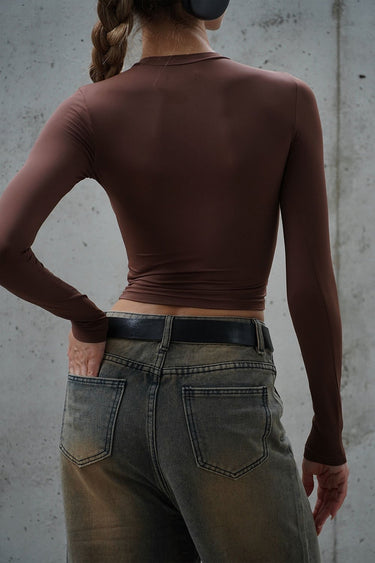 Brown full-sleeve polyamide top by Bonkers Corner, showcasing a fitted design and soft fabric for casual wear.