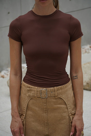Brown polyamide fitted T-shirt from Bonkers Corner, showing close-up of soft, stretchy fabric and tailored fit.