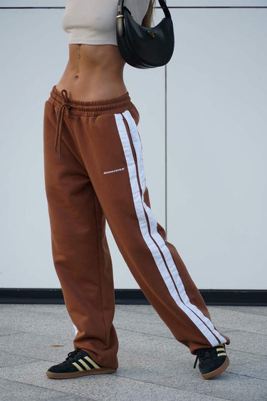 Brown sporty straight fit pants by Bonkers Corner, shown with a relaxed waistband and straight-leg design.