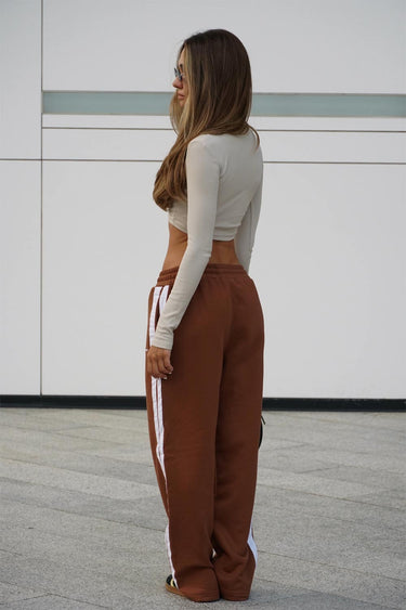 Brown sporty straight fit pants by Bonkers Corner, featuring a comfortable straight cut and athletic-inspired style.
