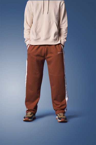 Brown sporty straight-fit pants by Bonkers Corner, casual athletic style, with a relaxed fit and elastic waistband.