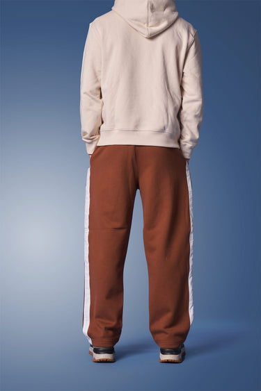 Brown sporty straight-fit pants by Bonkers Corner, featuring a comfortable, casual design and elastic waistband.