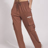 Brown utility straight fit pants by Bonkers Corner, featuring a classic design and functional pockets, shown on a model.