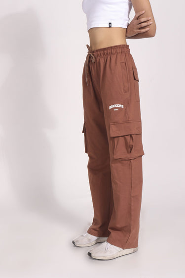 Brown utility straight fit pants by Bonkers Corner, with a casual design and functional pockets, shown on a model.