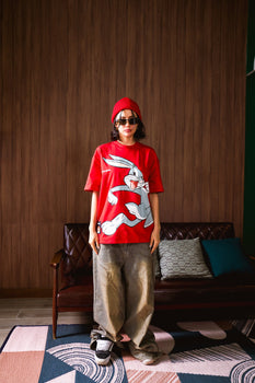 Red oversized Bugs Bunny T-shirt by Bonkers Corner featuring a graphic print of Bugs Bunny on the front.