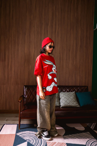 Red Bugs Bunny oversized T-shirt by Bonkers Corner featuring a cartoon Bugs Bunny graphic on the front.