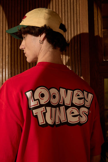 Red Bugs Bunny oversized T-shirt by Bonkers Corner featuring a cartoon Bugs Bunny graphic on the front.