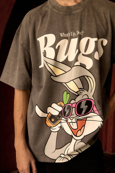 Bonkers Corner Bugs On Call oversized T-shirt in white featuring colorful bug illustrations on the front.
