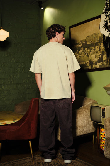 Bonkers Corner beige oversized T-shirt with Catanic design, relaxed fit and casual style, shown on a plain background.